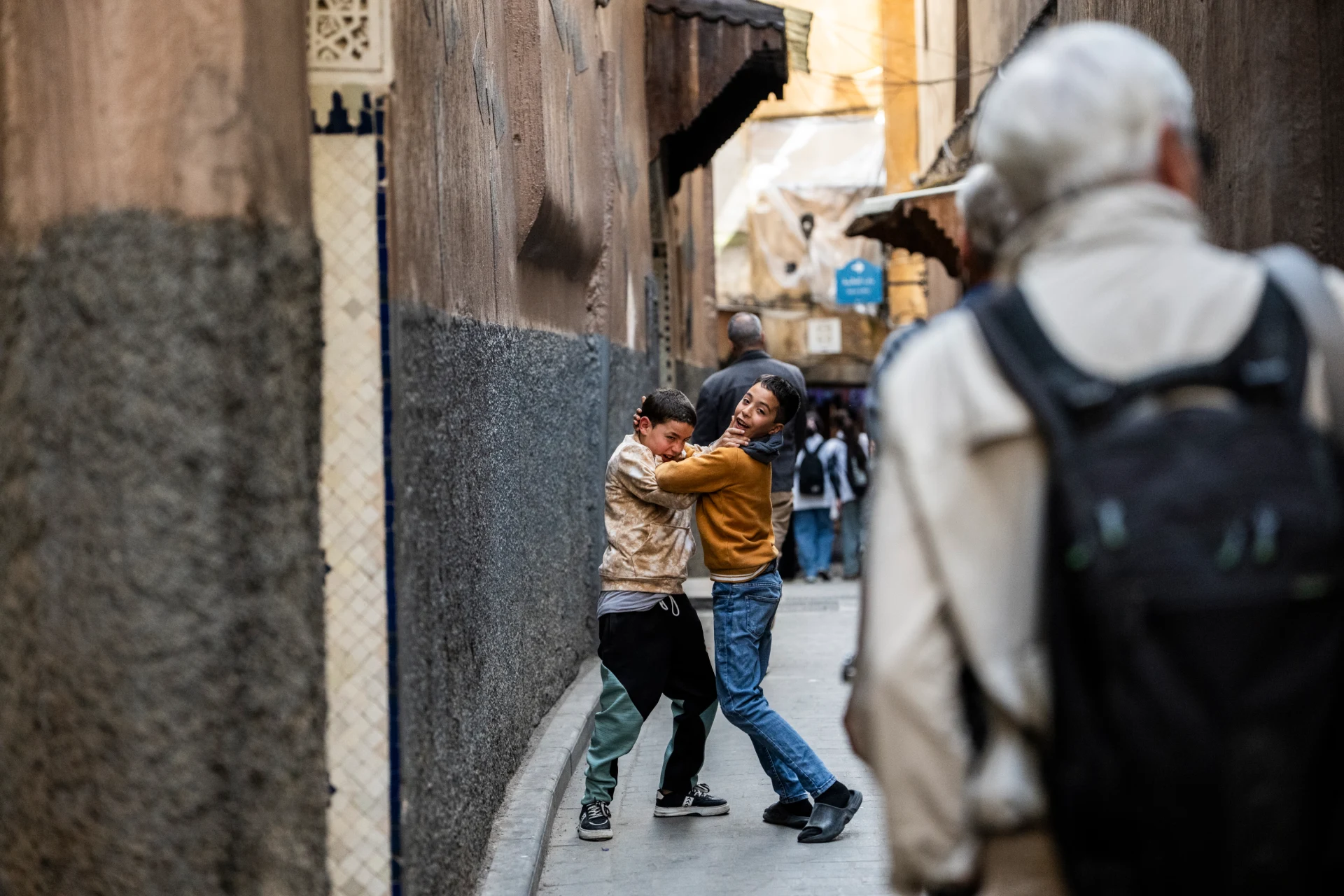 A traveler walking a medina lane